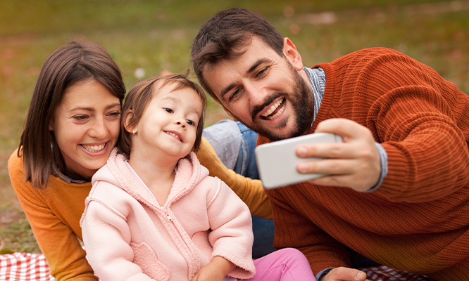 Happy-Family-Outside-Taking-a-Selfie